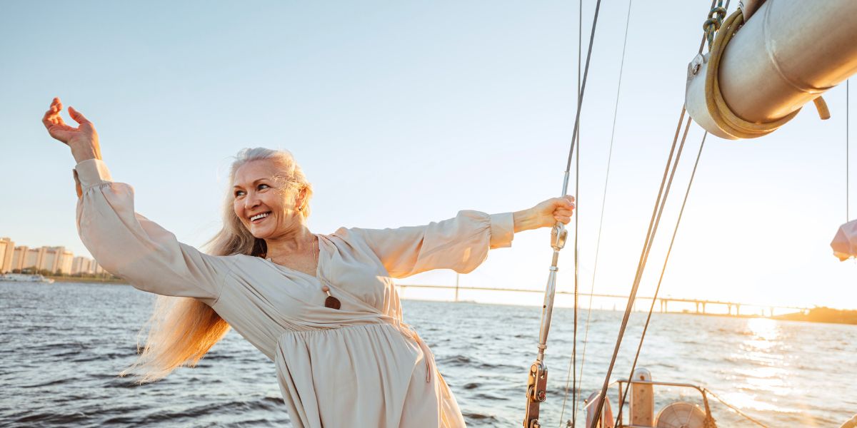 happy woman on sailboat